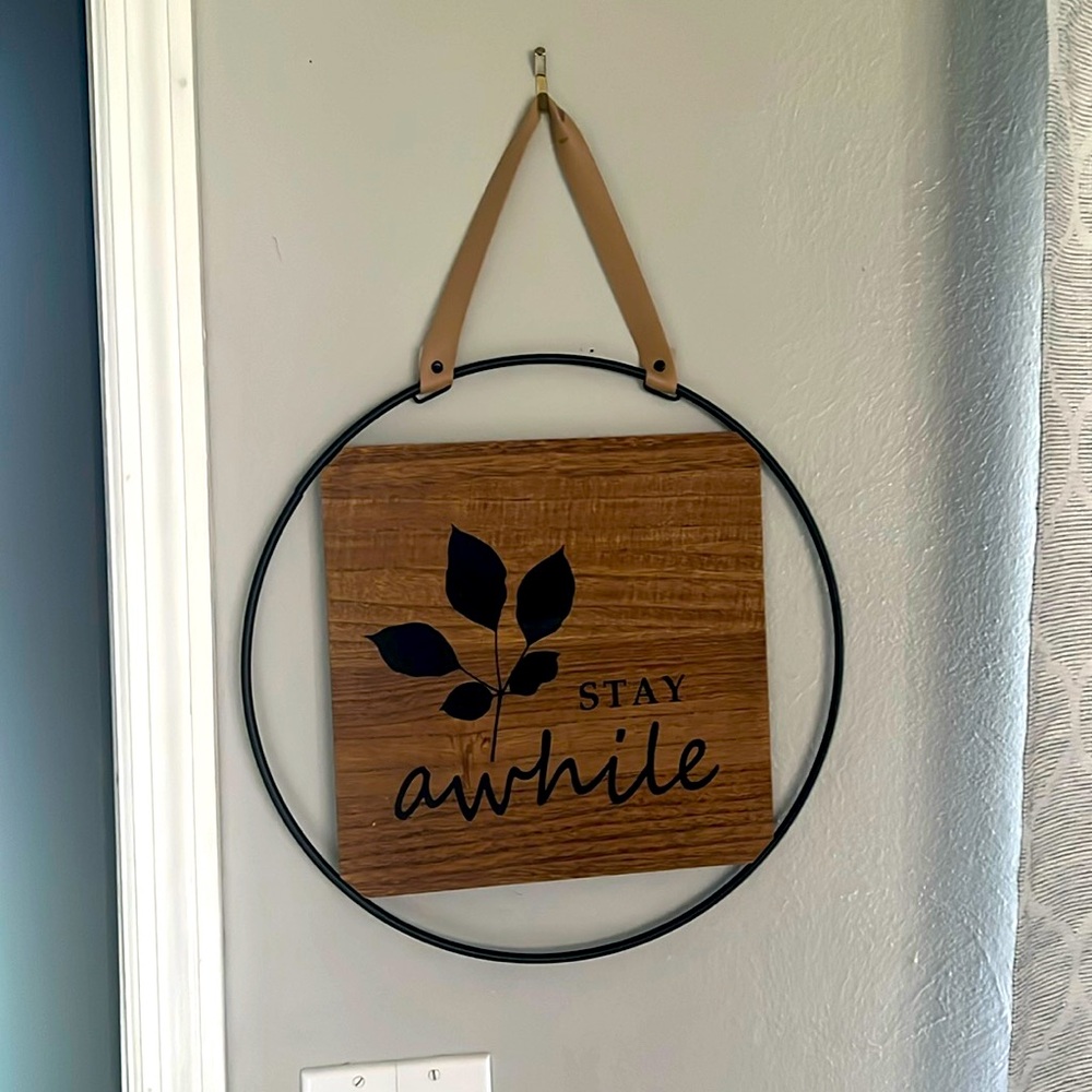 Stay Awhile sign with leather handle